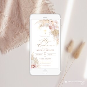 May include: A digital invitation for a Holy Communion celebration with a floral and pampas grass design. The invitation features a gold cross, the text "Holy Communion", and the name "Angela Mason". The date and time of the event are listed as "Saturday, July 21, 2028 at 1 PM". The location is "Sandal Church, Richmond Ave, York, Maine".