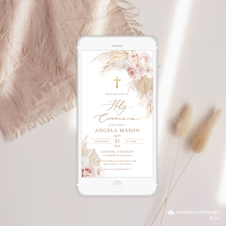 May include: A digital invitation for a Holy Communion celebration with a floral and pampas grass design. The invitation features a gold cross, the text "Holy Communion", and the name "Angela Mason". The date and time of the event are listed as "Saturday, July 21, 2028 at 1 PM". The location is "Sandal Church, Richmond Ave, York, Maine".