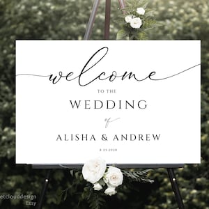 May include: White wedding welcome sign with black calligraphy text that reads "Welcome to the Wedding of Alisha & Andrew 8.25.2028".