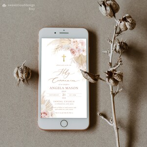 May include: A digital invitation for a Holy Communion celebration with a floral design featuring a cross, pampas grass, and roses in shades of pink and beige. The invitation includes the name Angela Mason, the date July 21, 2028, and the time 1 PM. The event will be held at Sandal Church.