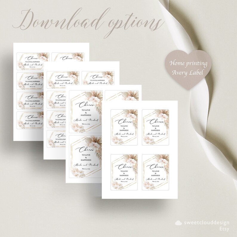 May include: Printable wedding favor tags with a boho theme. The tags feature a white background with gold geometric shapes, pampas grass, and white flowers. The text on the tags reads "Cheers to love and happiness".