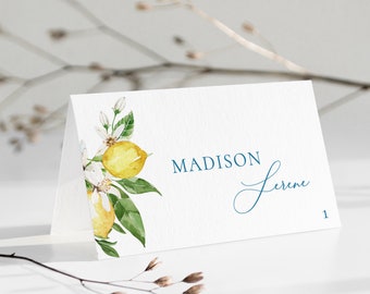 May include: White place card with a watercolor illustration of lemons and blossoms. The text "MADISON Serene" is printed in blue on the card. The number "1" is printed in the bottom right corner.