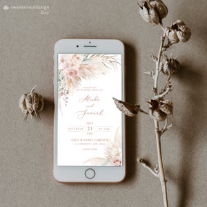 K&ouml;nnte beinhalten: Eine digitale Hochzeitseinladung mit einem floralen Design aus getrocknetem Pampasgras und rosafarbenen Rosen. Die Einladung lautet: "Bitte feiern Sie mit uns die Hochzeit von Alishe und Jamal, Samstag, 21. Juli 2028 um 17:00 Uhr, Salt & Sand Garden in Richmond Ave, York, Maine."