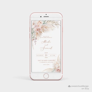 K&ouml;nnte beinhalten: Eine digitale Einladung zu einer Hochzeit mit floralem Design. Die Einladung zeigt eine Aquarell-Illustration von Pampasgras, Rosen und Gr&uuml;npflanzen. Der Text lautet: "Bitte begleiten Sie uns zur Hochzeitsfeier von Alishe und Jamal, Samstag, 21. Juli 2028 um 17:00 Uhr, Salt & Sand Garden, in der Richmond Ave, York, Maine. Empfang im Anschluss."
