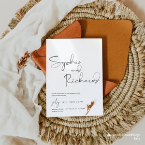 May include: Wedding invitation with a white background and black calligraphy text. The invitation reads "Sophie and Richard" followed by the date "July 14th, 2025" and time "2 PM". The invitation also includes the location "Rosemary Fields / 1235 Bayview Ave, Santa Rosa".