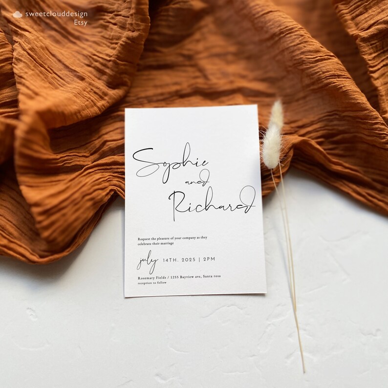 May include: A white wedding invitation with black calligraphy for Sophie and Richard. The invitation includes the date and time of the wedding, July 14th, 2025 at 2 PM, and the location, Rosemary Fields, 1255 Bayview Ave, Santa Rosa.