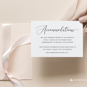 May include: A white card with black text that reads "Accommodations". The text says "We have reserved rooms at the Marriott Hotel. Please use the promo code 'OURWEDDING' to receive 15% discount. For further information and directions to the venue, please visit our website. www.happilyevercouple.com"