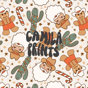 May include: A repeating pattern on a light background featuring gingerbread people in cowboy hats, cacti decorated with string lights, candy canes, and stars. The text CAMILA PRINTS is centred in dark grey, bold, rounded, and slightly distorted lettering.