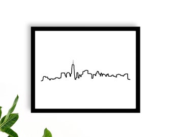 May include: A black and white line art print of the New York City skyline. The print is framed in a black frame.