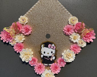 Adorno para birrete de graduación con forma de gatito