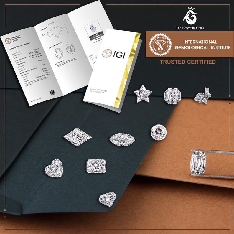 May include: A collection of loose, faceted, clear gemstones in various shapes including heart, star, marquise, and rabbit, accompanied by an International Gemological Institute laboratory report and a pair of metal tweezers holding an oval stone.