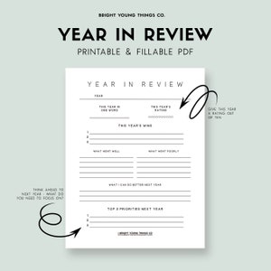 May include: A white "Year in Review" printable PDF with prompts for reflection, including sections for wins, areas for improvement, and future priorities. The document is designed to help users assess their year and plan for the next.