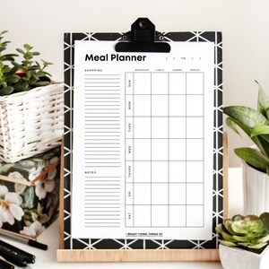 May include: A black and white printable meal planner with a checklist for shopping, notes, and a weekly calendar for breakfast, lunch, dinner, and snacks.