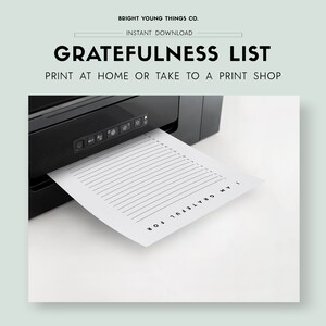 May include: A printable gratitude list with the text "I am grateful for" and 25 lines to write on. The list is being printed from a black printer.