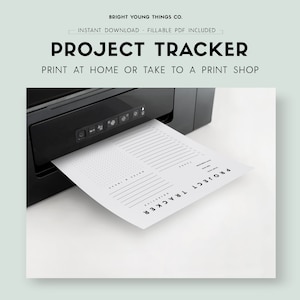 May include: A black printer printing a white Project Tracker sheet. The sheet has lines and dots for notes and tasks. The text on the sheet reads "Project Tracker" and "Print at home or take to a print shop."