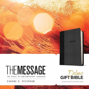 May include: A black leather-look deluxe gift bible with the text "THE MESSAGE" on the cover. The bible is set against a background of a sunset with water splashing.