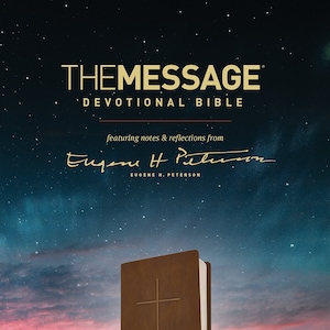 May include: A brown leather-look devotional Bible with a gold cross embossed on the cover. The Bible is titled "The Message" and features notes and reflections from Eugene H. Peterson. The background is a starry night sky with a red and orange sunset.