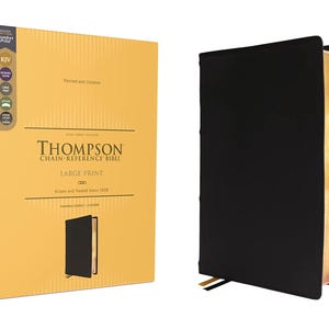 May include: A large print Thompson Chain-Reference Bible in a black leather cover, with a gold-edged page block. The book is shown next to its original box, which is yellow with black text and a small image of the Bible.