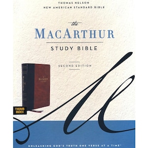 May include: The MacArthur Study Bible, Second Edition, New American Standard Bible, by Thomas Nelson. The cover is blue and brown with a thumb index.