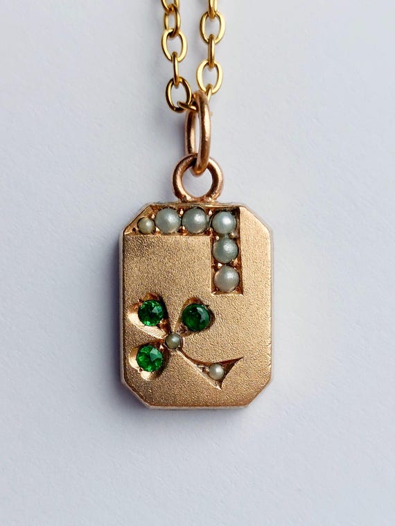 Edwardian 9k rose gold clover charm with seed pearls and green stones