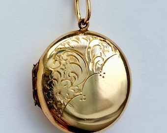 Edwardian 9ct B&F round locket with floral engravings