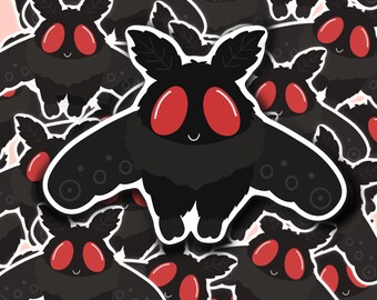 May include: A repeating pattern of black moth stickers with red eyes. The moths have a cartoon-like appearance and are smiling.