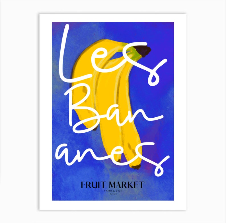 May include: A blue and yellow poster with the text "Les Bananes" in white cursive writing. The poster also includes the text "FRUIT MARKET" in black text and the words "France, 2022" in smaller black text.