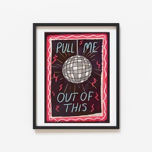 May include: Framed art print with a disco ball illustration. The artwork has a black background with the text "PULL ME OUT OF THIS" in white and blue. The disco ball is silver, surrounded by yellow rays and red lightning bolts, within a red border.