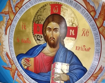 May include: A religious icon painting of Jesus Christ, depicted with a red robe and blue cloak, holding a book. The background is a gold circle with a red cross and the text "IC XC KPATWP" in Greek. The painting is surrounded by a blue background with white clouds and orange and white angels.
