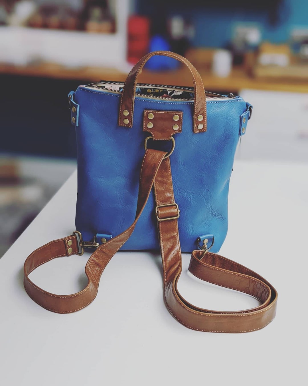 Blue and Brown Leather Backpack With Multiway Strap for Carrying as a