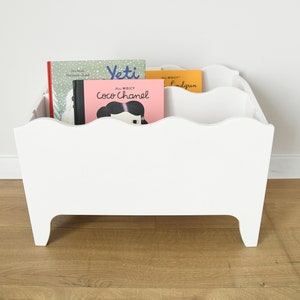 A montessori bookshelf for nursery, a small kids wooden bookcase, a box for toys, books storage