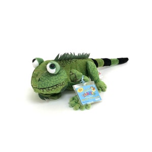 May include: Green iguana plush toy with a Webkinz tag that says "Discover a virtual world".