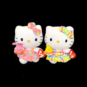 TY "Hello Kitty" in Spring Dress Holding Baby Animal // Beanie Baby (6 inches)