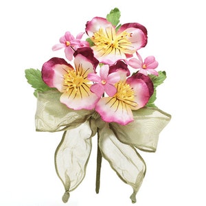 May include: A bouquet of pink and yellow paper flowers with green leaves and a brown ribbon.