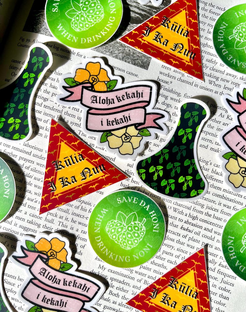May include: A collection of colorful stickers with Hawaiian and tropical themes. The stickers feature phrases like "Aloha kekahi i kekahi", "Kūlia i ka Nuʻu", and "Save Da Honī When Drinking Noni".