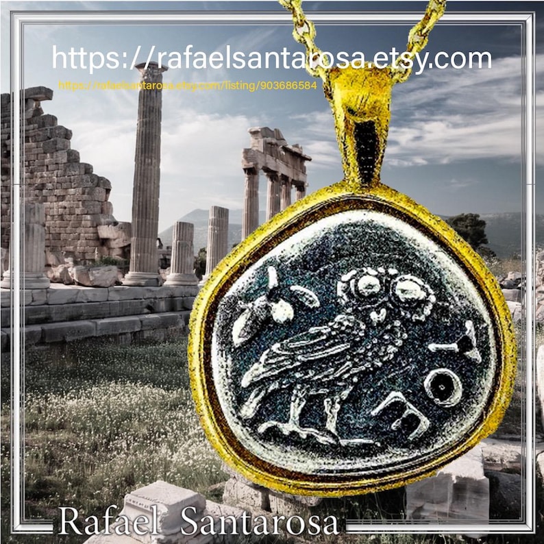 May include: A gold-toned pendant featuring a circular coin design with a relief of an owl and the Greek letters AOE. The pendant is suspended from a gold-toned chain. The text https://rafaelsantarosa.etsy.com and Rafael Santarosa are visible.