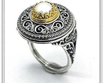 Oxidised sterling silver ring with 18k gold filled bezel and natural pearl center stone.