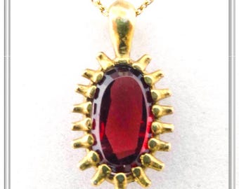 Natural garnet fancy pendant made of sterling silver 18 karat gold-filled, freeform cut dark red garnet in a handmade silver bezel.