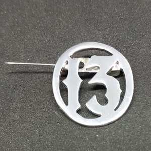 13 recycled aluminum lapel pin