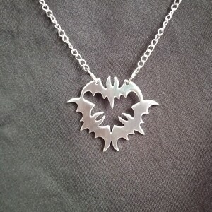 Acrobats recycled aluminum pendant necklace