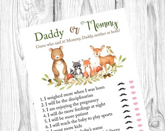 May include: A baby shower game card titled "Daddy or Mommy". The card features illustrations of woodland animals and a list of statements to guess who said them. The text "Daddy or Mommy" is in green.