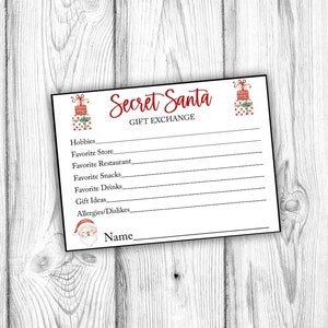 May include: A printable Secret Santa gift exchange card with a festive red and green illustration of a stack of presents. The card includes lines for writing down hobbies, favorite store, favorite restaurant, favorite snacks, favorite drinks, gift ideas, allergies/dislikes, and name.
