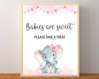May include: A printable sign with a pink and white watercolor background featuring a gray elephant with pink polka dots and a pink bow. The sign says "Babies are sweet" and "Please take a treat".