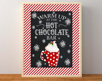 May include: A red and white striped sign with the text "Warm Up at the Hot Chocolate Bar" in white lettering on a black background. A red and white polka dot mug with whipped cream and a cherry on top is in the center of the sign.