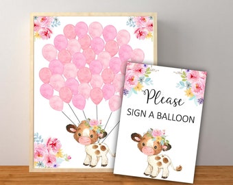 May include: A pink and white baby shower sign with a cow holding pink balloons. The sign says "Please sign a balloon".