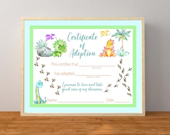 May include: A framed certificate of adoption featuring watercolor illustrations of dinosaurs. The certificate has a light blue border, a green inner border, and includes the text "Certificate of Adoption" and spaces to fill in the adopter's and dinosaur's names.
