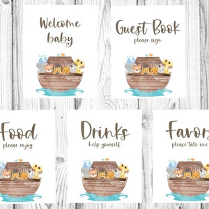May include: Five printable signs with a watercolor illustration of animals on a boat. The signs say "Welcome Baby", "Guest Book Please Sign", "Food Please Enjoy", "Drinks Help Yourself", and "Favors Please Take One".