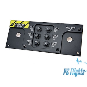 Może przedstawiać: Czarny panel z żółto-czarną etykietą ostrzegawczą z napisem "EMERG BK STEER". Panel posiada kilka przełączników oznaczonych jako "AFCS ESS DC", "AFCS ESS AC" i "RUD PED ADJ".