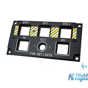 May include: Black metal panel with six rectangular cutouts and a round cutout. The panel has labels for "ENG 1", "APU", "ENG 2", "PRI", "TEST", "RES", and "FIRE DET/EXTG".