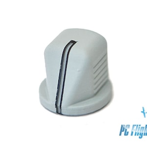 以下が含まれることがあります： 中央に黒い線が引かれた灰色のプラスチック製のノブ。ノブは表面がざらざらしていて、上部に小さな穴があります。